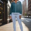 Melissa NY Cityscape in teal and grey track jacket leggings and deck shoes art concierge clothing JPG