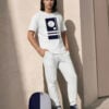 Giovanni in the pinstripes series champion t shirt, plain fleece joggers canvas high top shoes and minimalist backpack navy blue light blue white front art concierge clothing jpg